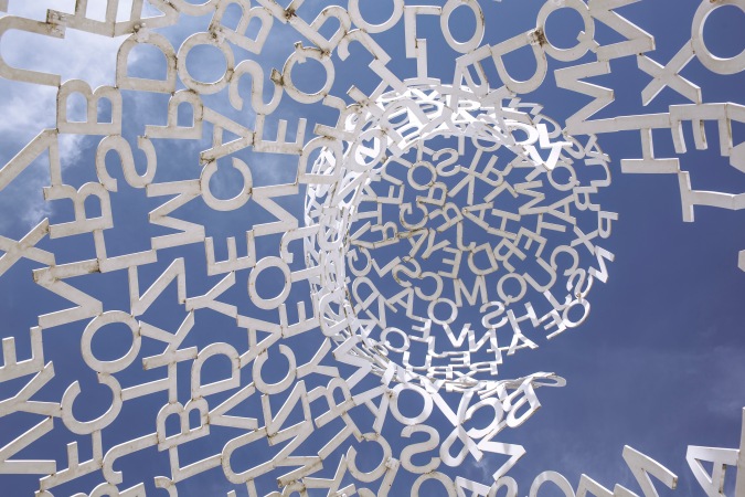 A sculpture of letters against a blue sky. I was so taken by this image of words spiraling up to the sky, I made it my Twitter header:)